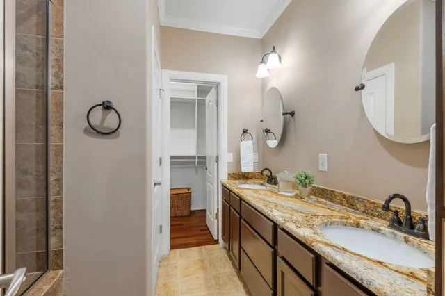 a bathroom with a sink a vanity and a mirror