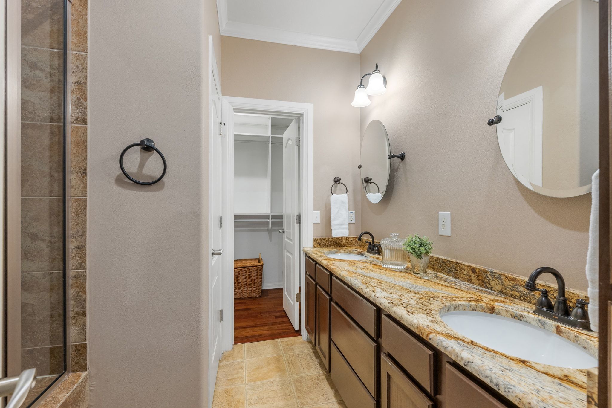 6801 Beckett Road, Unit 134L Austin, TX 78749 - Photo 18 of 30 a en suite bathroom with a granite countertop sink and a mirror