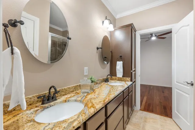 a bathroom with a shower and a mirror