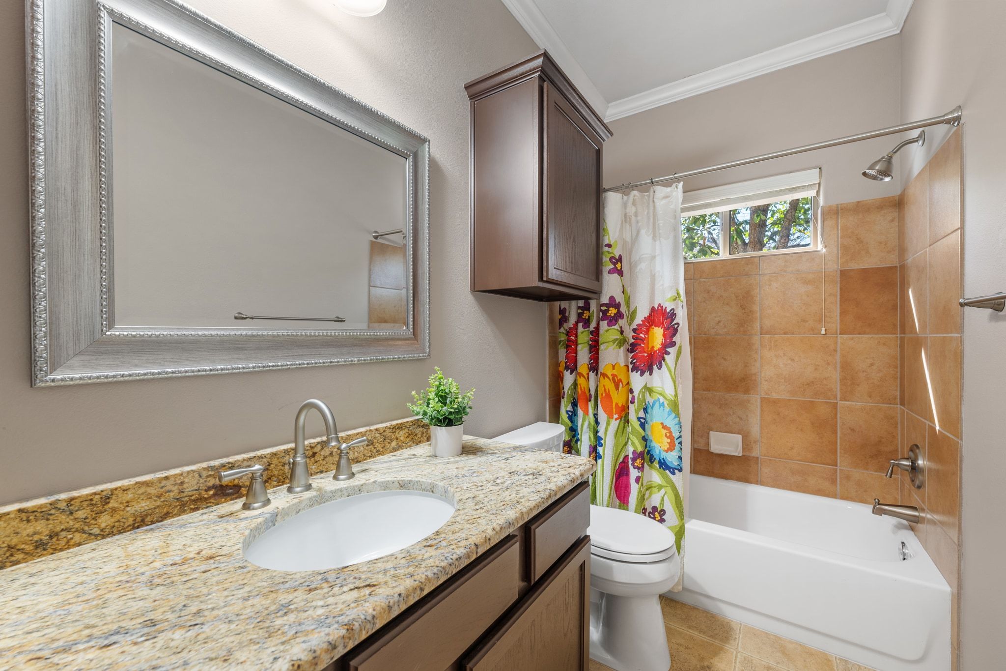 6801 Beckett Road, Unit 134L Austin, TX 78749 - Photo 24 of 30 a bathroom with a granite countertop sink a toilet and shower