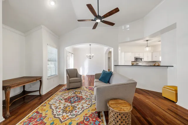 a living room with furniture and a rug