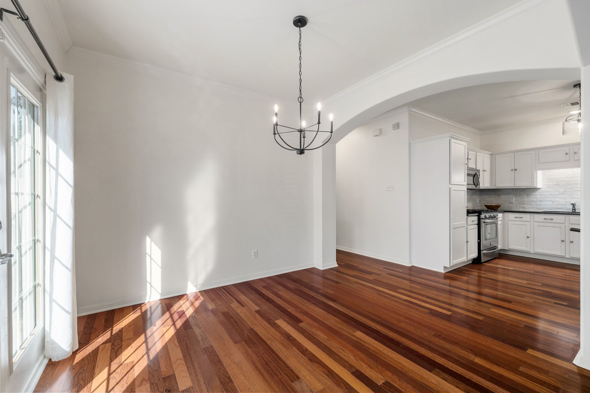 6801 Beckett Road, Unit 134L Austin, TX 78749 - Photo 10 of 30 a view of kitchen and empty room with wooden floor