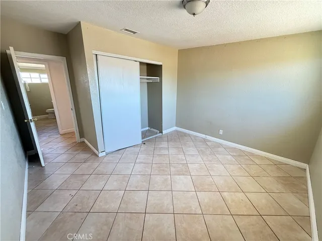 a view of a livingroom with an empty space and a sink cabinets