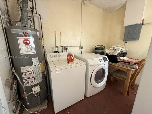 a utility room with dryer and washer