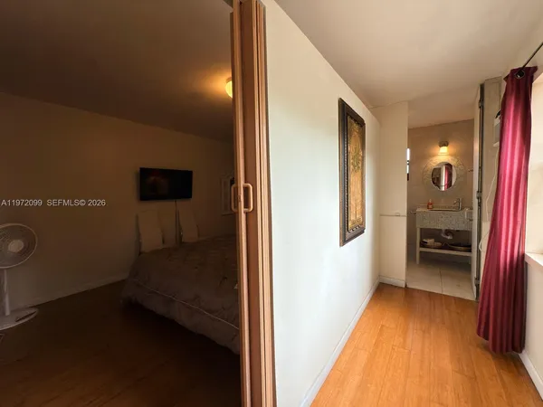 a en suite bathroom with a sink and a mirror
