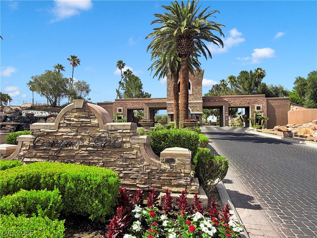8981 Rivers Edge Drive Las Vegas, NV 89117 - Photo 56 of 69 Elegant entrance welcomes residents home with lush landscaping and architectural detail.