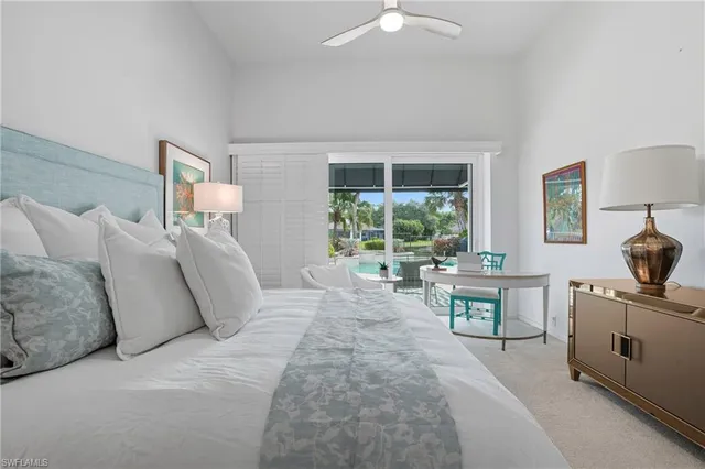 a spacious bedroom with a large bed and a window