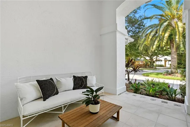 a view of a chairs and a table in the patio