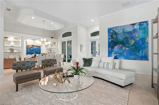 a living room with furniture and a painting