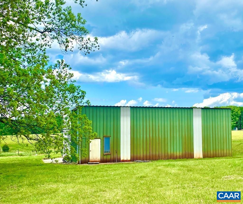 2586 Five Forks Road Pamplin, VA 23958 - Photo 14 of 22 a view of a garden with a building in the background