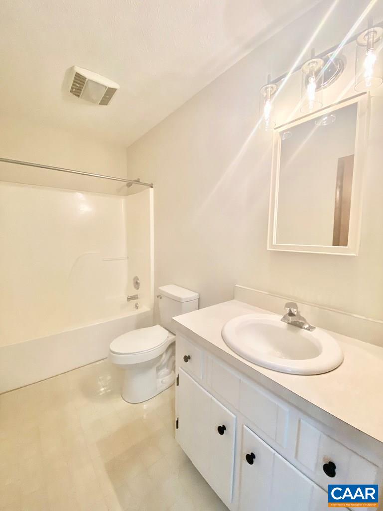 2586 Five Forks Road Pamplin, VA 23958 - Photo 9 of 22 a bathroom with a sink a toilet and shower