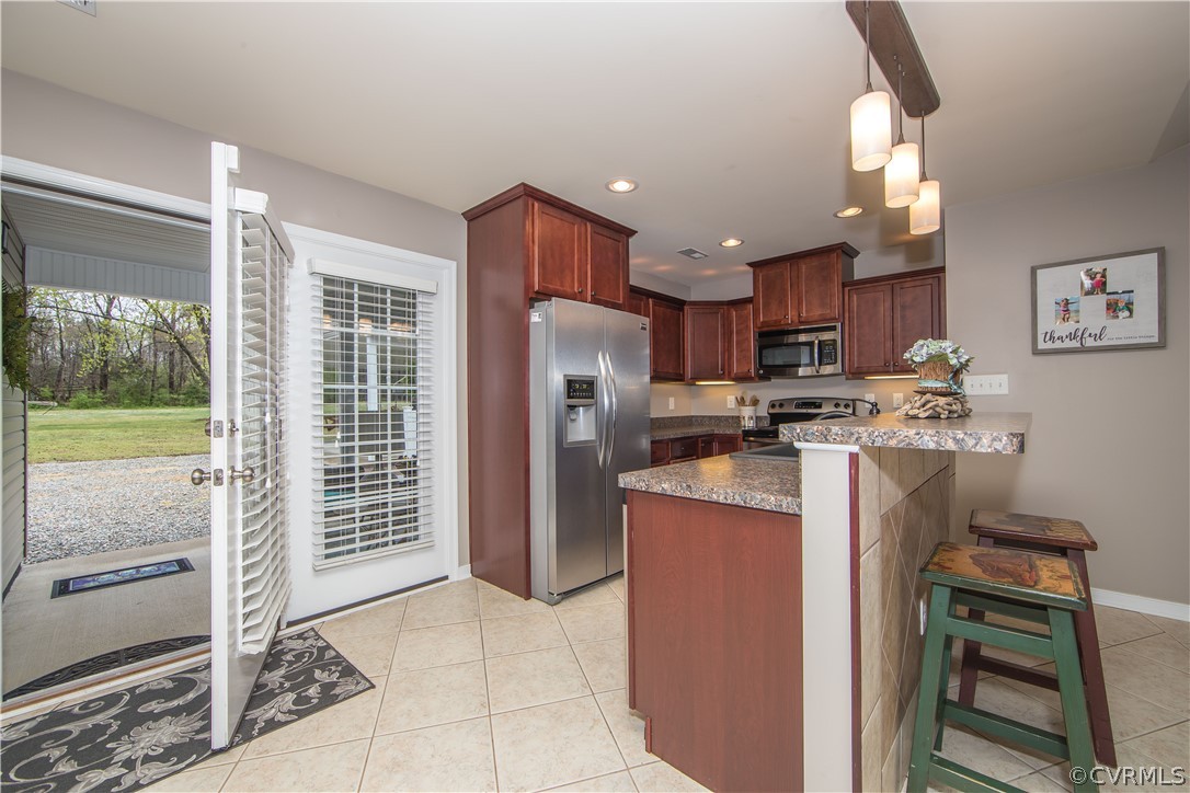 6908 River Road Petersburg, VA 23803 - Photo 7 of 32 Kitchen w/ Tile Flooring, Stainless Steel Applianc