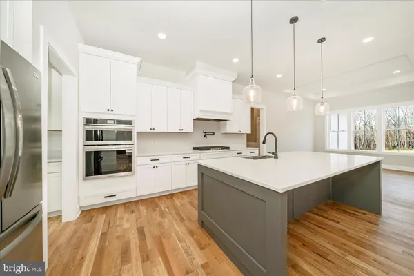 a view of kitchen with wooden floor