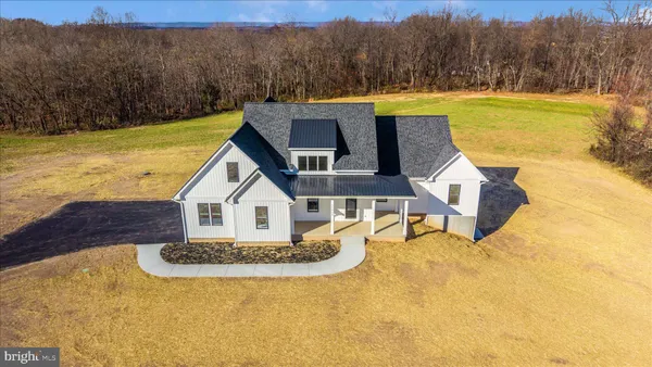 a view of a house with pool and a view of a house with a yard