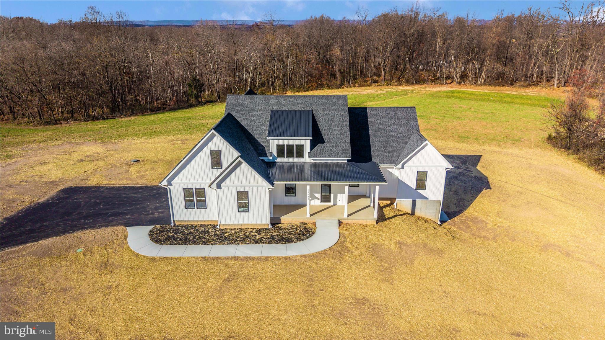 15030 New Windsor Road New Windsor, MD 21776 - Photo 2 of 63 a view of a house with pool and a view of a house with a yard