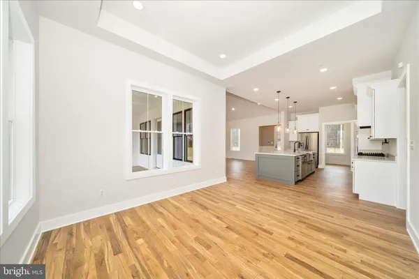 a view of a bedroom from wooden floor