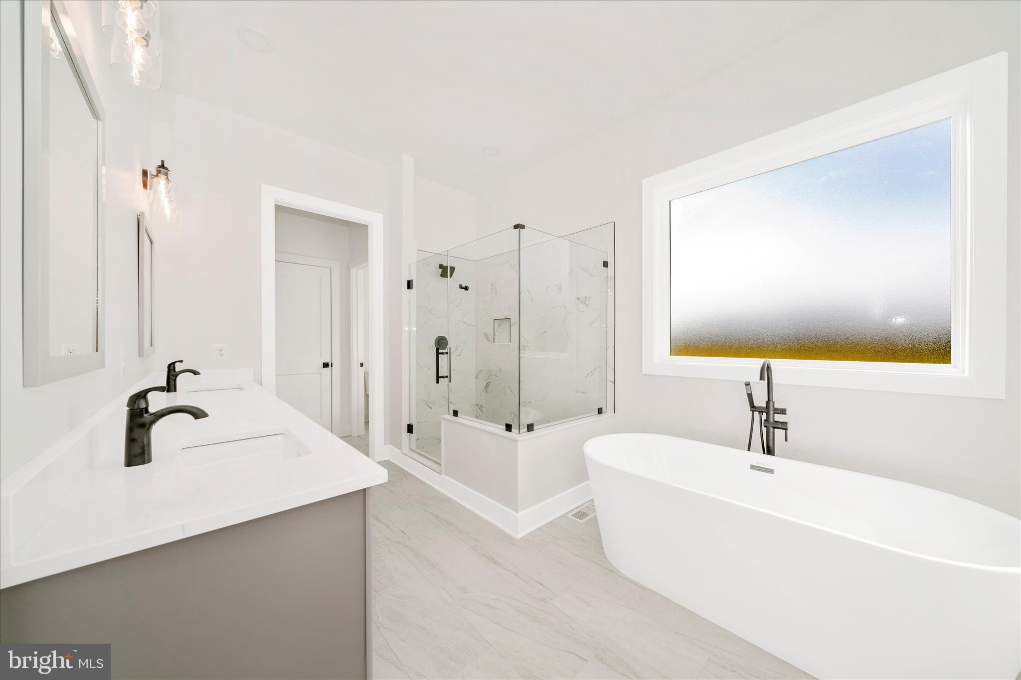 15030 New Windsor Road New Windsor, MD 21776 - Photo 26 of 63 a bathroom with a tub sink and mirror