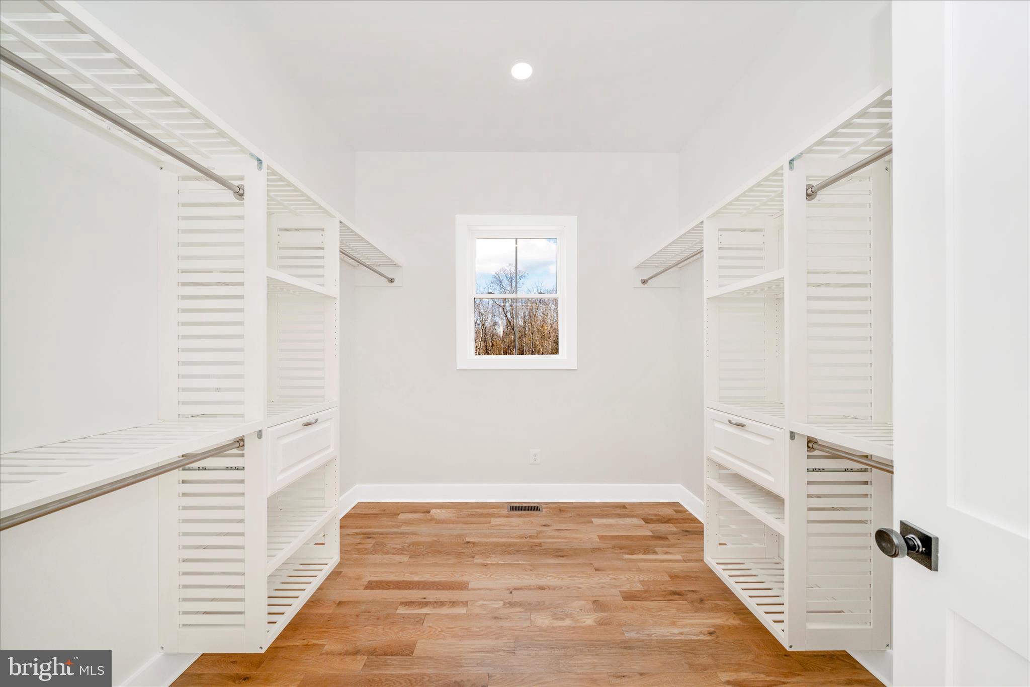 15030 New Windsor Road New Windsor, MD 21776 - Photo 27 of 63 a view of a hallway with wooden floor and a bathroom