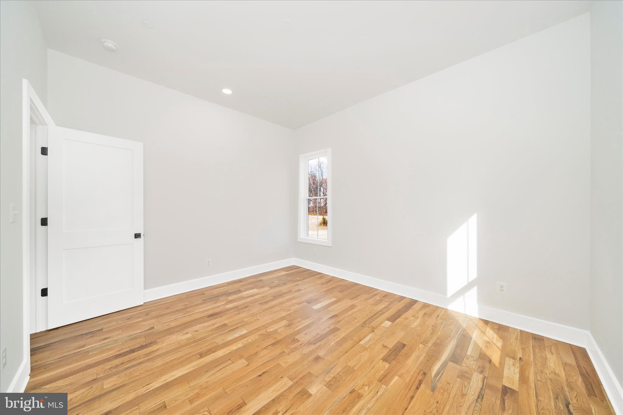 15030 New Windsor Road New Windsor, MD 21776 - Photo 34 of 63 a view of empty room with wooden floor