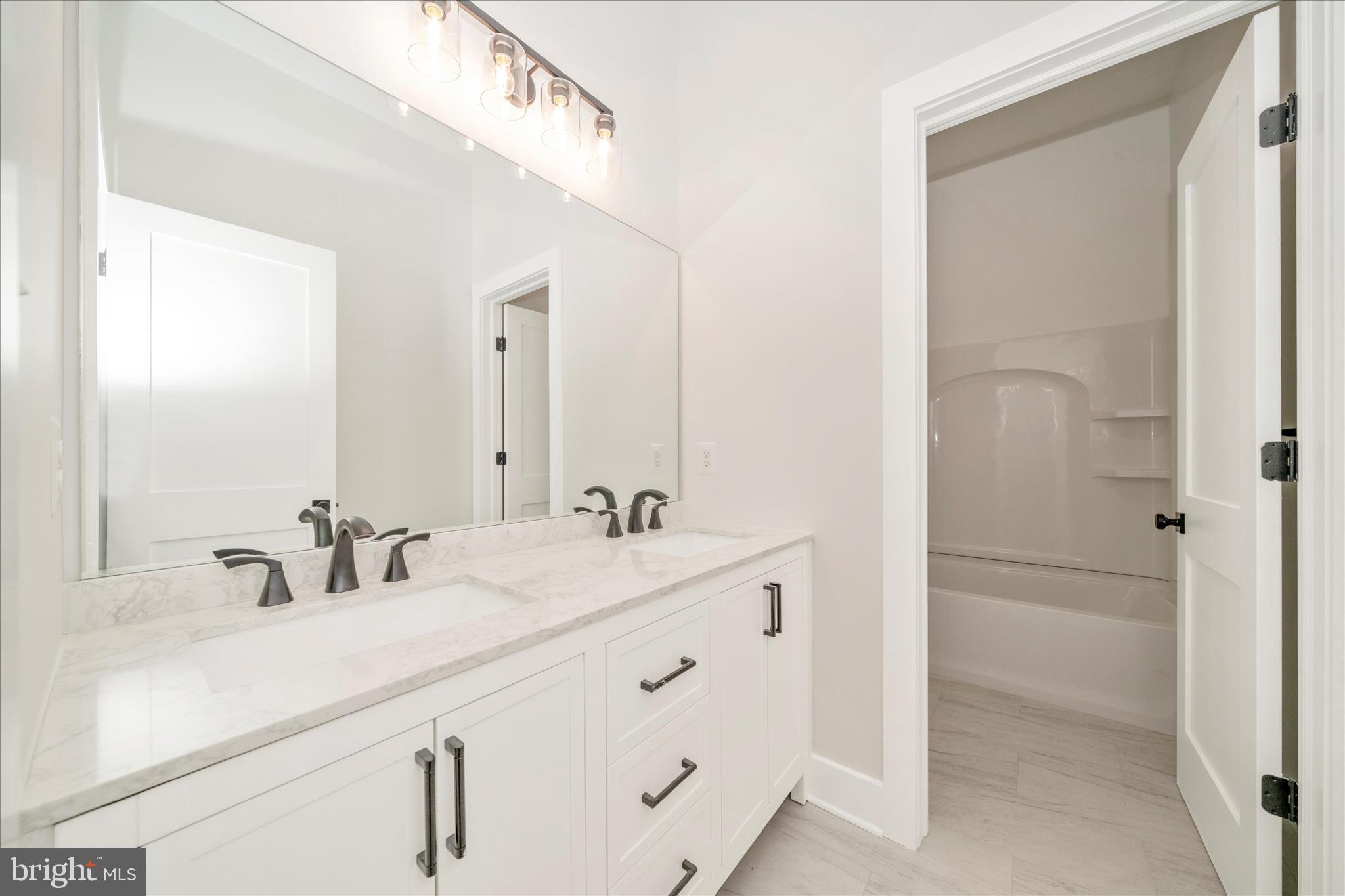 15030 New Windsor Road New Windsor, MD 21776 - Photo 39 of 63 a bathroom with a sink and a mirror
