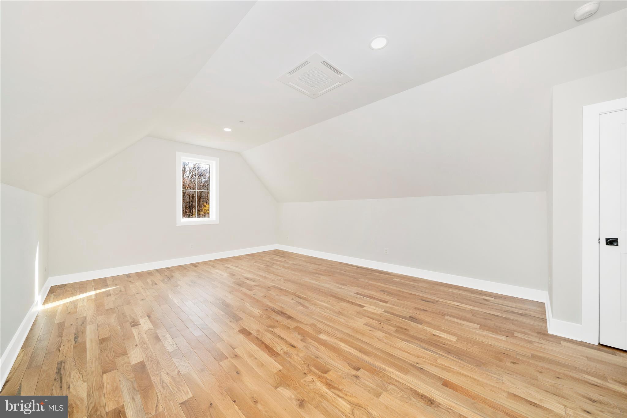 15030 New Windsor Road New Windsor, MD 21776 - Photo 40 of 63 an empty room with wooden floor and windows