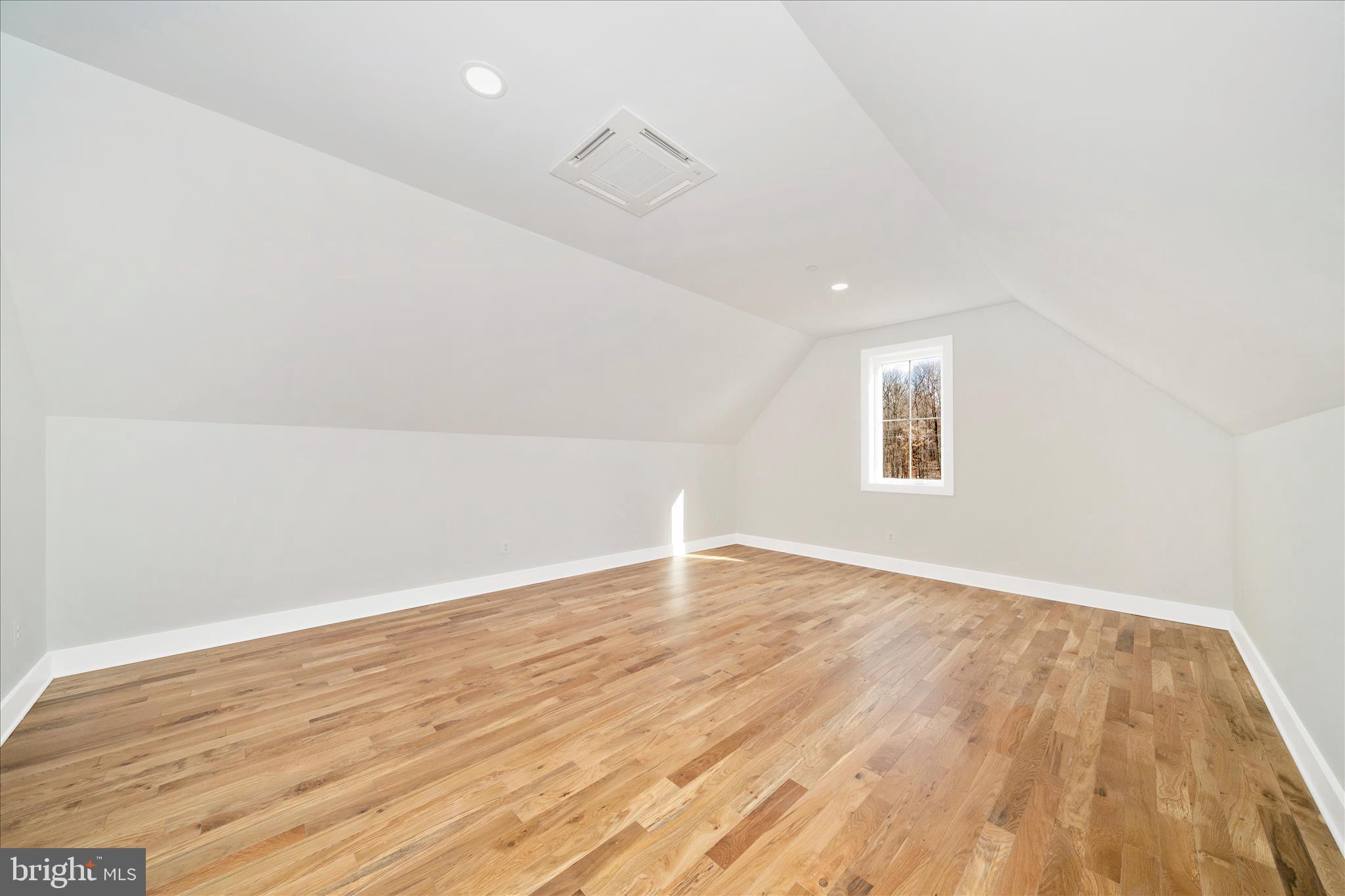 15030 New Windsor Road New Windsor, MD 21776 - Photo 41 of 63 an empty room with wooden floor and windows