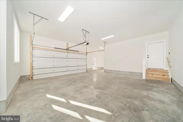 a view of a swimming pool with an outdoor seating and yard in the back