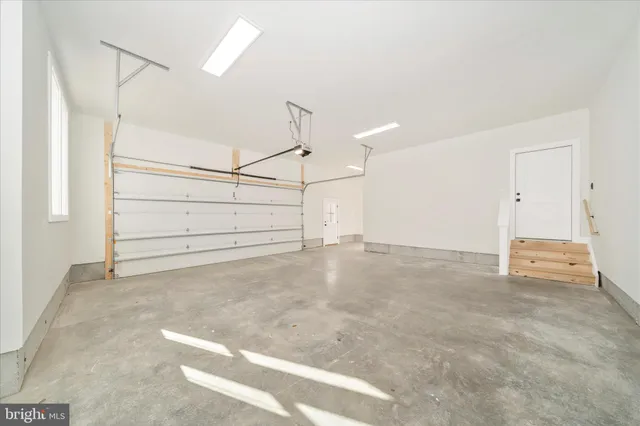 a view of a swimming pool with an outdoor seating and yard in the back