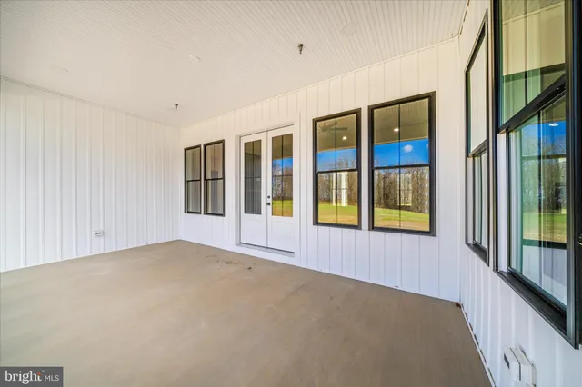a view of a swimming pool with seating area