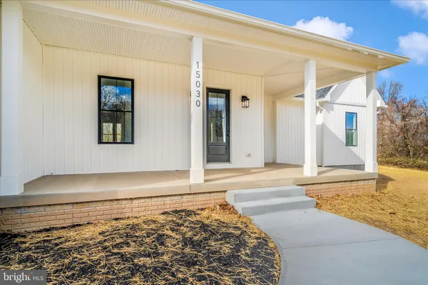 a view of livingroom with hardwood floor and a ceiling fan