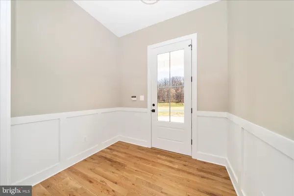 a large kitchen with kitchen island a sink stainless steel appliances and cabinets