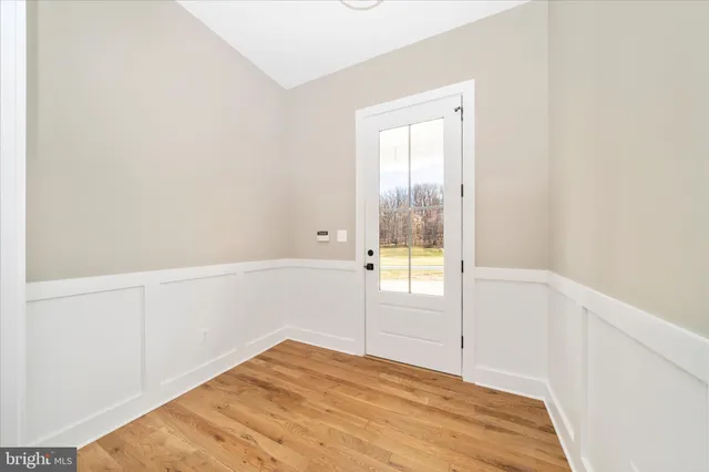 a large kitchen with kitchen island a sink stainless steel appliances and cabinets
