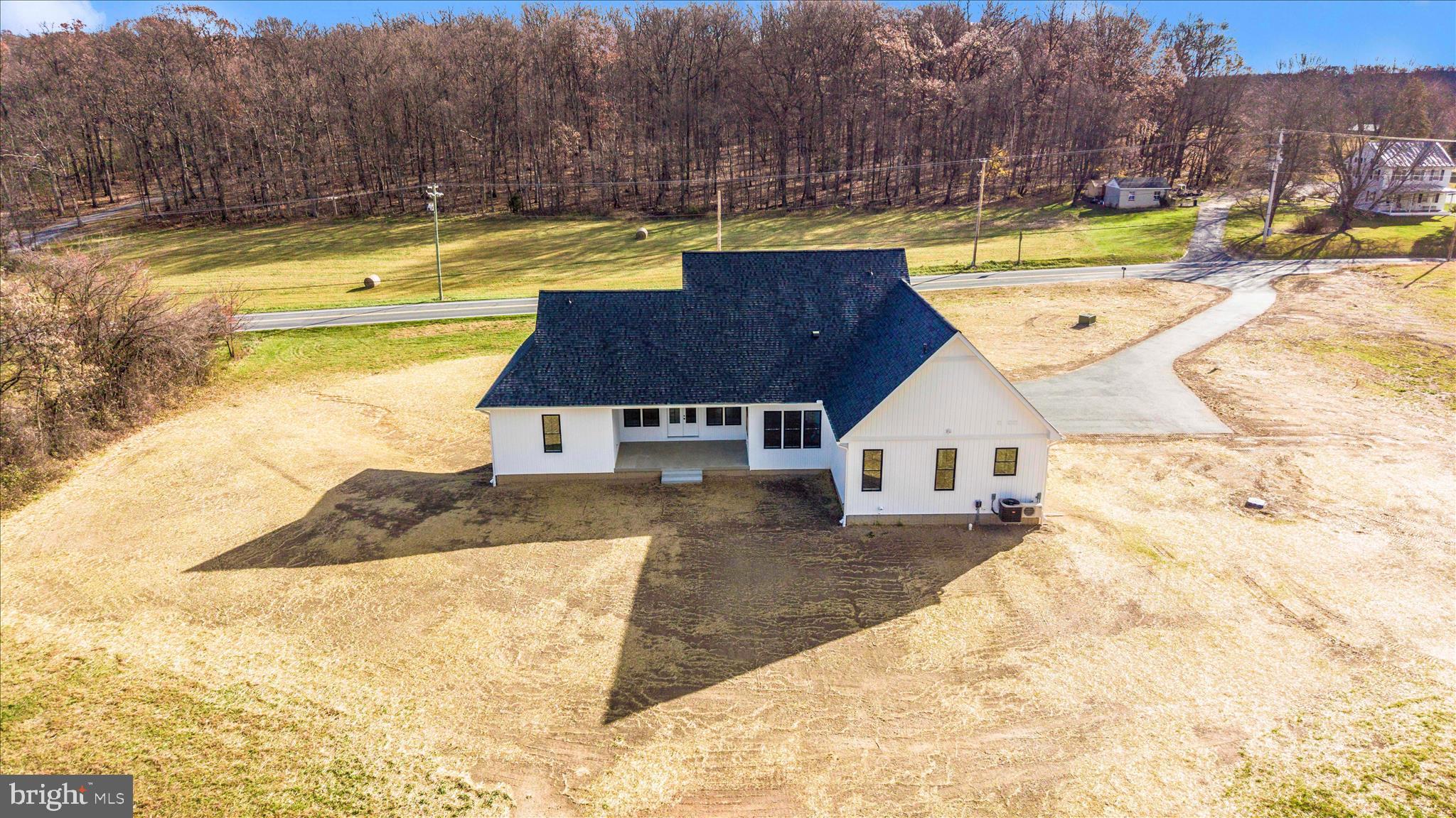 15030 New Windsor Road New Windsor, MD 21776 - Photo 61 of 63 a view of a swimming pool with a house