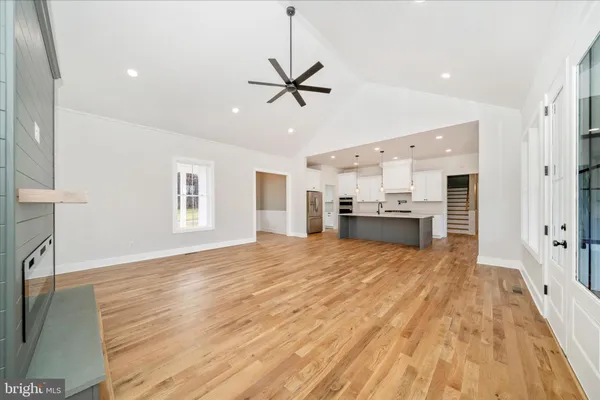 a kitchen with stainless steel appliances a sink stove and refrigerator