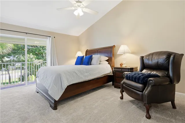 a spacious bedroom with a bed and a couch