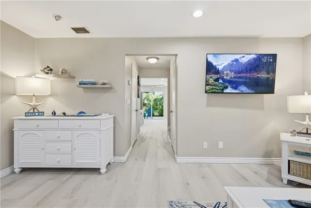 a room with cabinets and a painting on the wall