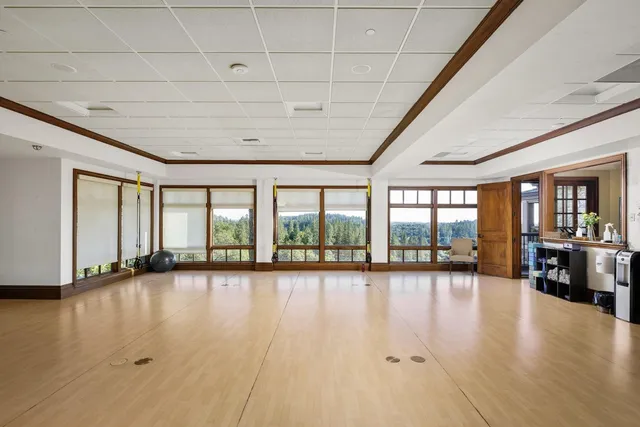 a view of a patio with table and chairs and potted plants