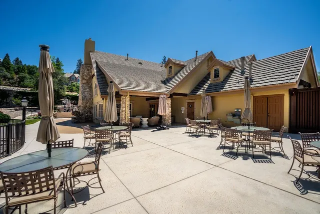 a view of a swimming pool with an outdoor seating