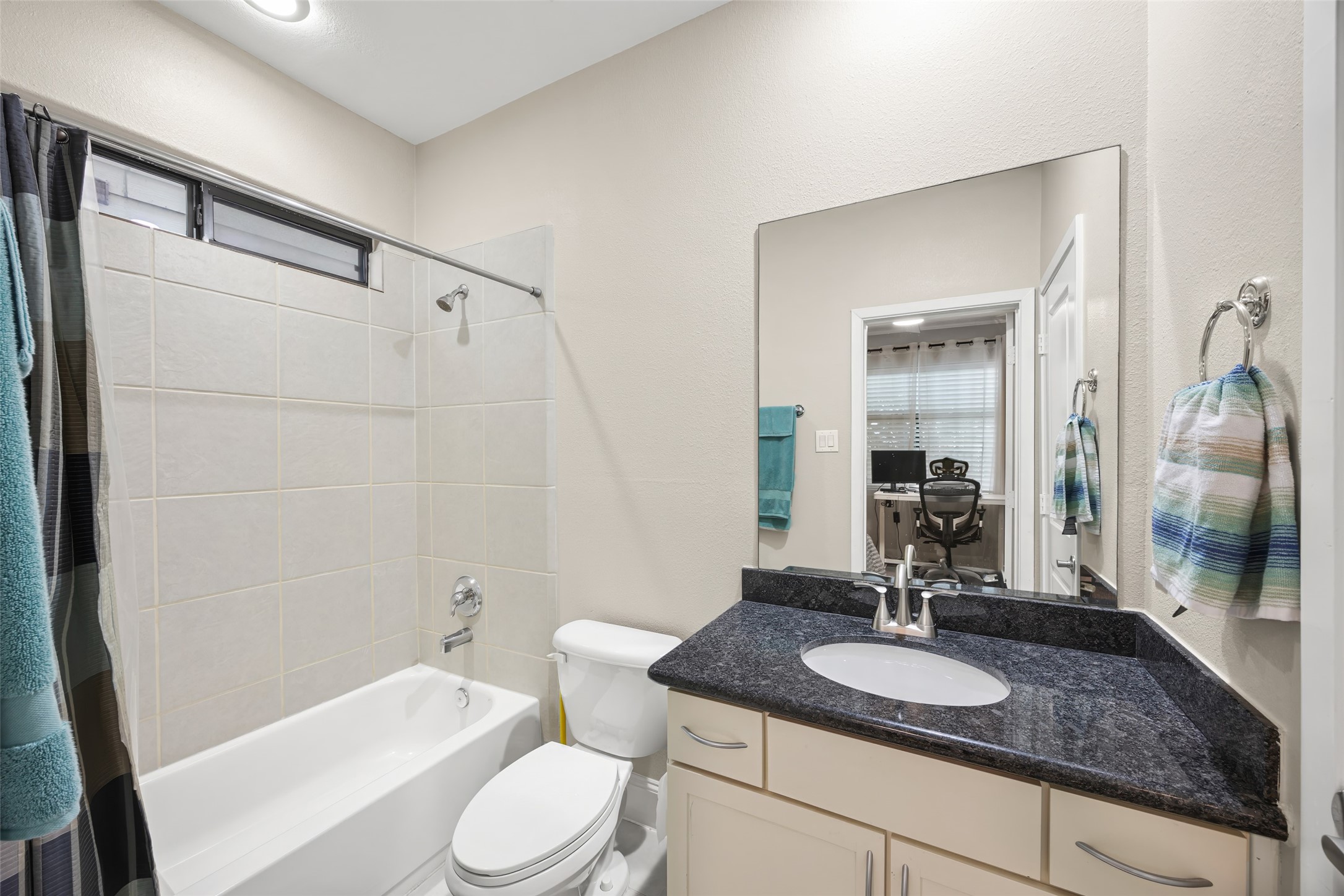 2320 Emancipation Avenue Houston, TX 77004 - Photo 11 of 38 a bathroom with a granite countertop sink toilet and shower
