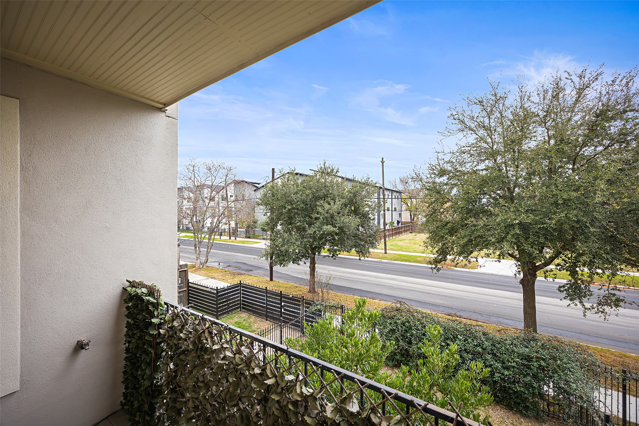 2320 Emancipation Avenue Houston, TX 77004 - Photo 14 of 38 a view of a balcony with floor to ceiling windows and wooden fence