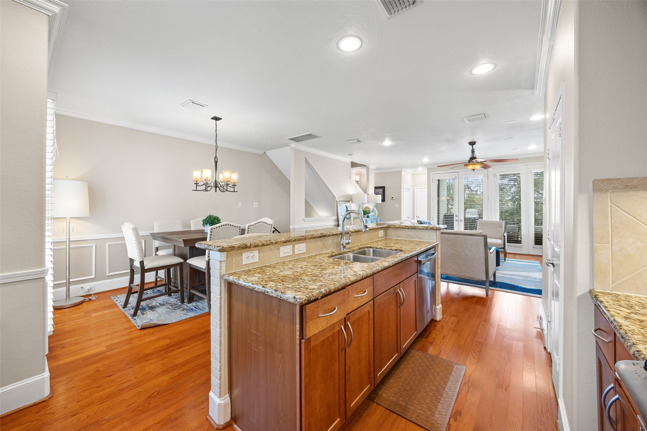 2320 Emancipation Avenue Houston, TX 77004 - Photo 22 of 38 wooden floor with kitchen view and living room
