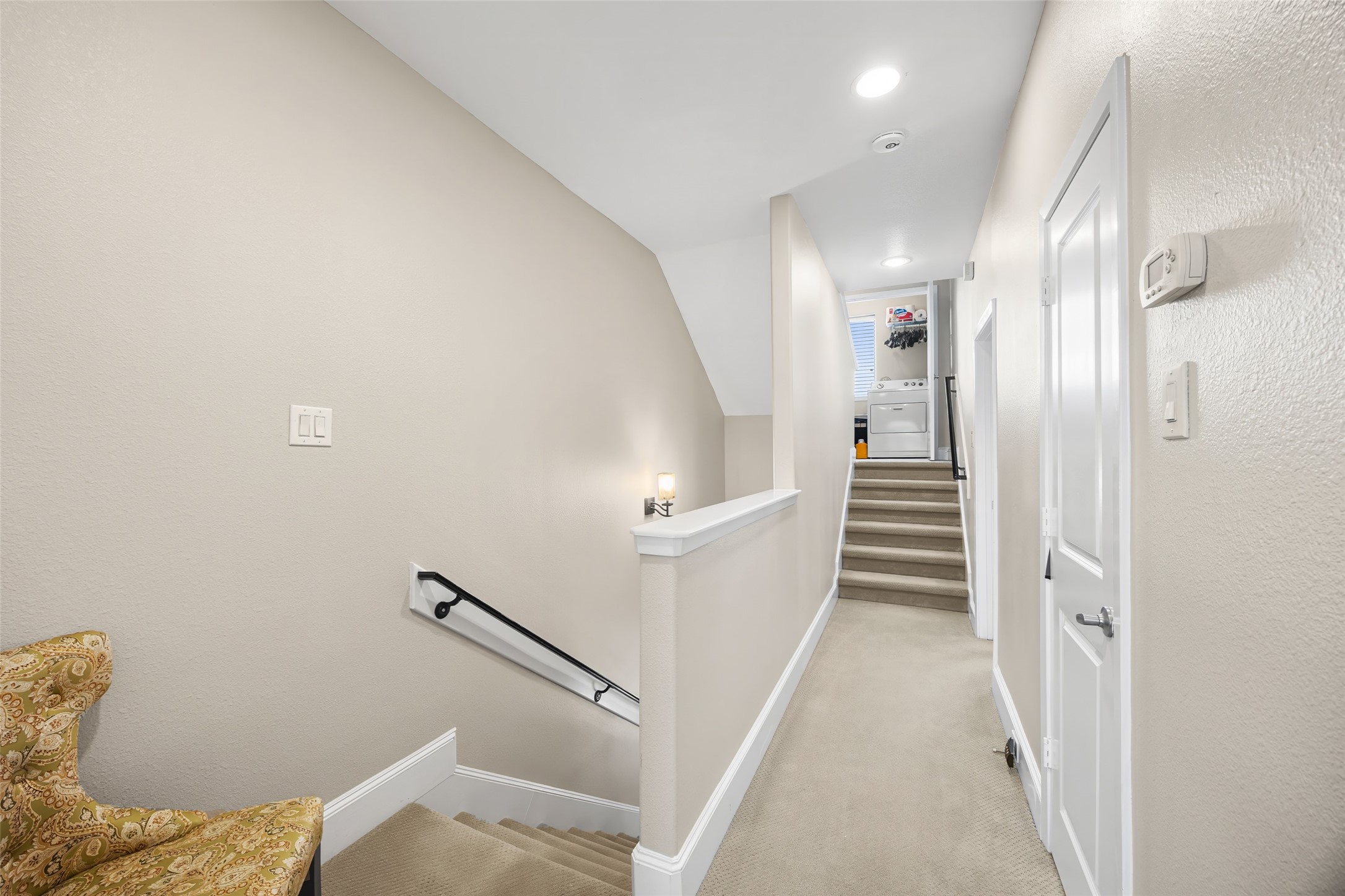 2320 Emancipation Avenue Houston, TX 77004 - Photo 24 of 38 a view of a hallway with stairs and wooden floor