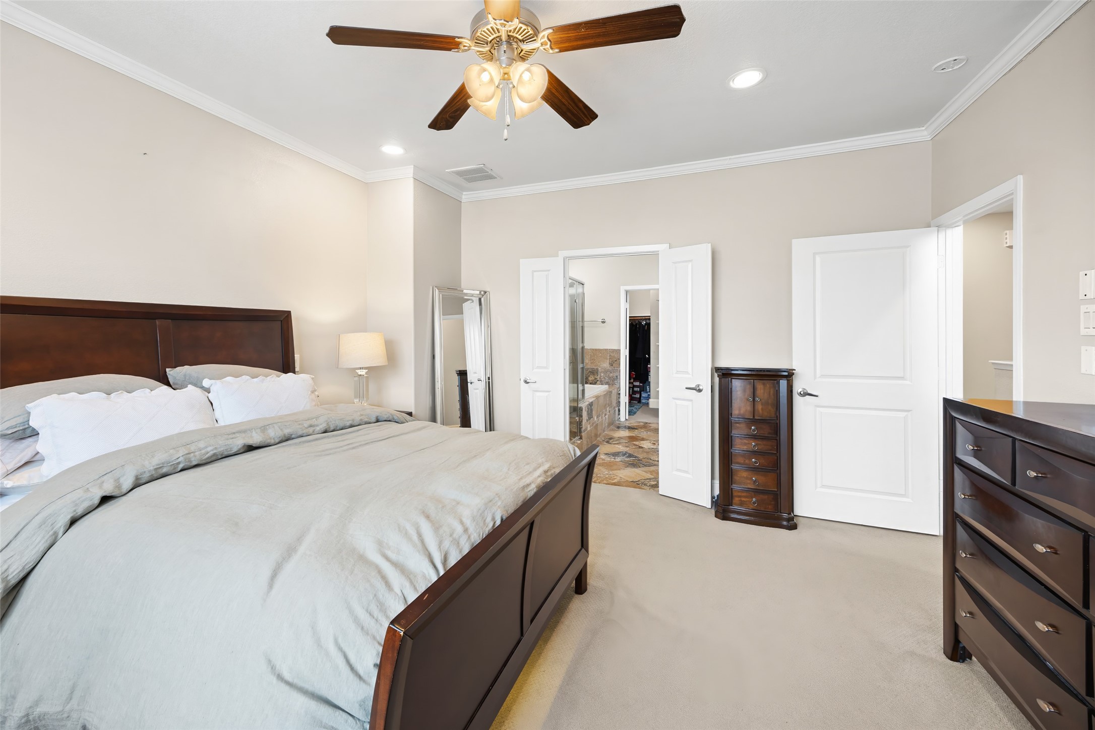 2320 Emancipation Avenue Houston, TX 77004 - Photo 26 of 38 a bedroom with a bed and a chandelier