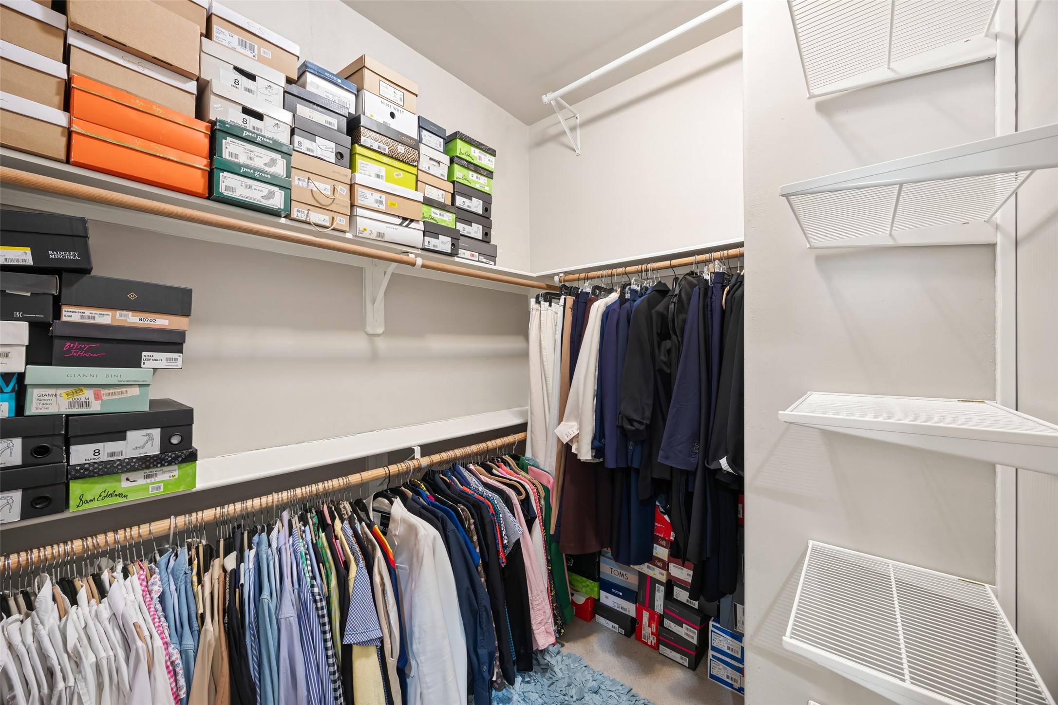 2320 Emancipation Avenue Houston, TX 77004 - Photo 30 of 38 a view of walk in closet with clothes and shoes