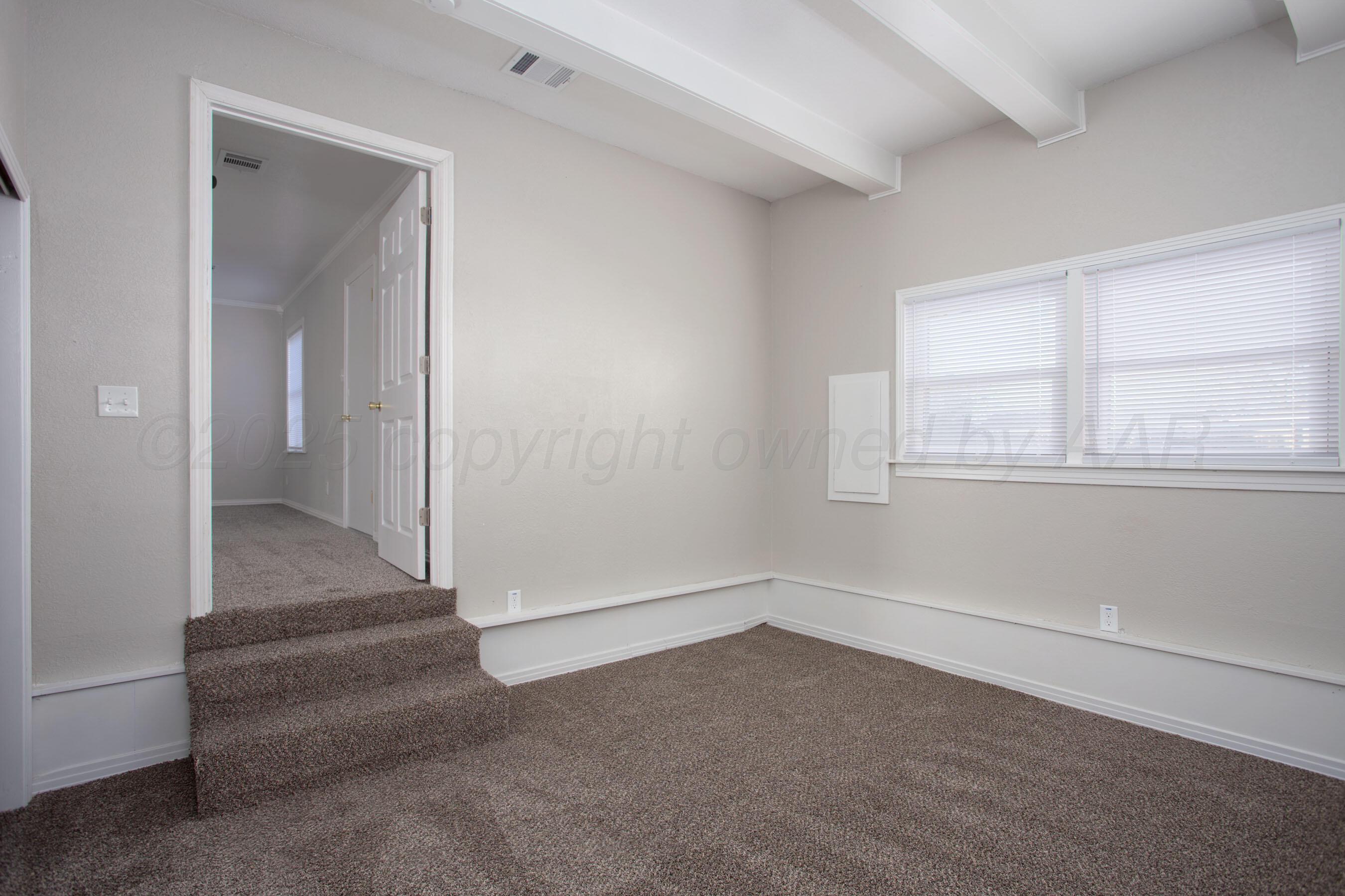 1928 Cherry Street Amarillo, TX 79106 - Photo 18 of 24 an empty room with a empty space and windows