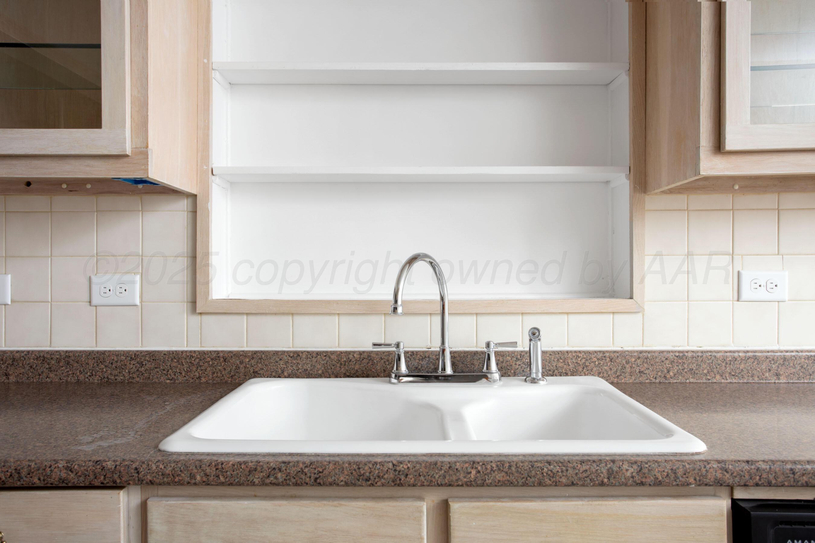 1928 Cherry Street Amarillo, TX 79106 - Photo 4 of 24 a close view of sink and tap