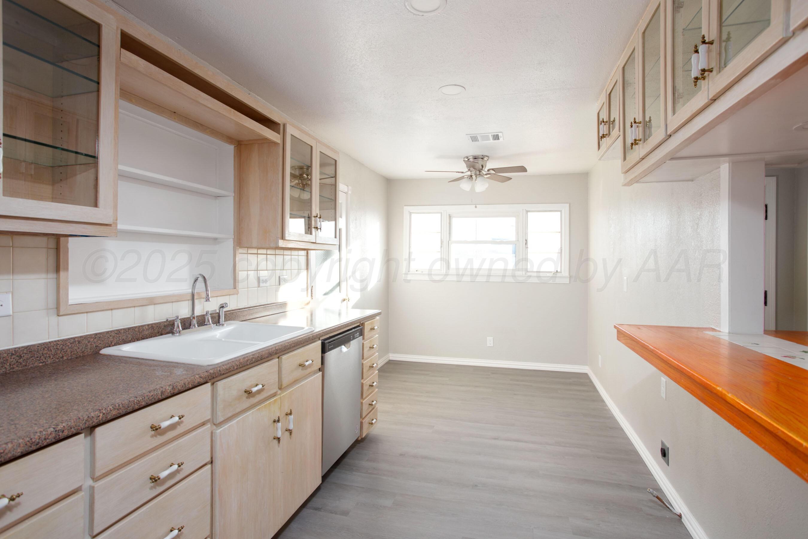 1928 Cherry Street Amarillo, TX 79106 - Photo 5 of 24 a hallway with sink and mirror