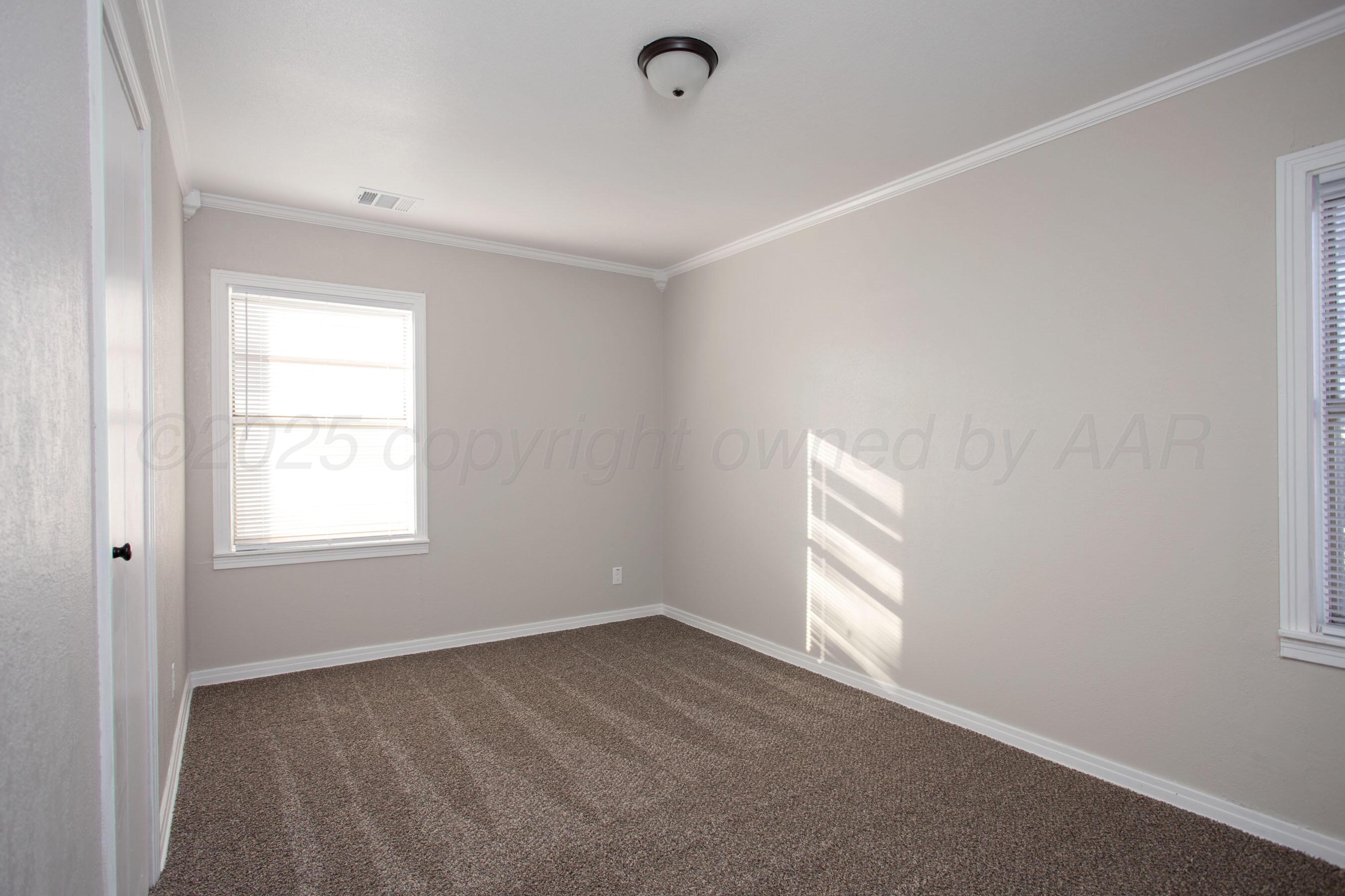1928 Cherry Street Amarillo, TX 79106 - Photo 10 of 24 an empty room with a window