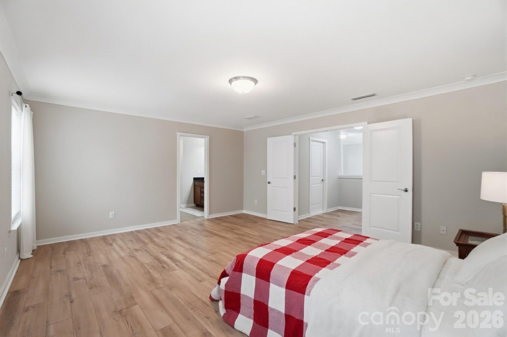 2153 Bluebell Way Tega Cay, SC 29708 - Photo 29 of 48 a bedroom with a bed and a window