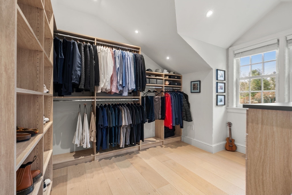 389 Grove Street Needham, MA 02492 - Photo 24 of 40 a view of walk in closet with clothes and shoes